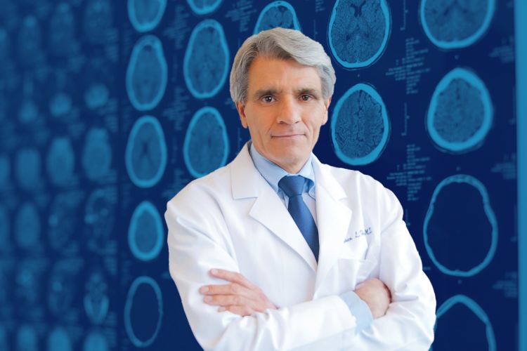 Image of Dr. Stephen Hauser in front of a graphic grid MRI brain scans with blue coloring