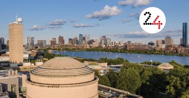Aerial view of MIT dome with Charles River and Boston visible in the distance. Layered on top is a white circle with the number 24.