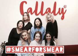 group of women in front of Callaly sign