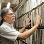 VJ at MIT's WMBR radio station looks though records 
