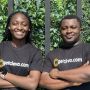Cleva founders Tolu Alabi, left, and Philip Adama Abel ’15 stand side by side with arms folded wearing company T-shirts.