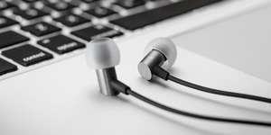 Stock image: earbuds and laptop