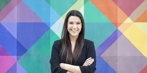 Rocio Fonseca portrait in front of colorful wall