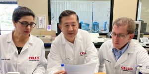 Jie Zhang in a lab with two other people 