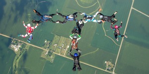 MIT alums skydiving in the shape of a T for Tech