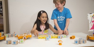 Kids play with the Kinderlabs KIBO robot