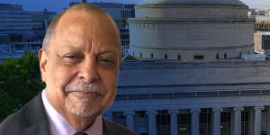 A headshot of Michael Fant is layered on top of a photo of the MIT dome.