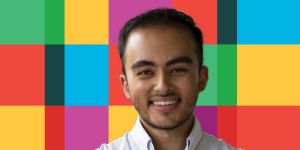 A photo of Yusuf Ahmad on a background of a primary color grid