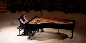 View from above of Mi-Eun Kim playing a grand piano.