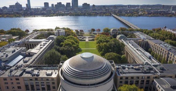Aerial photo of the MIT Dome and Killian Court overlooking the Charles River