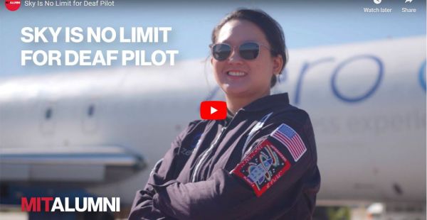 Pilot Sheila Xu ’14 standing in front of an airplane in a pilots uniform and sunglasses