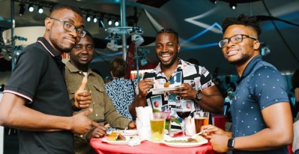 Image: Four MIT10 alumni at a Tech Reunions party giving thumbs up. 