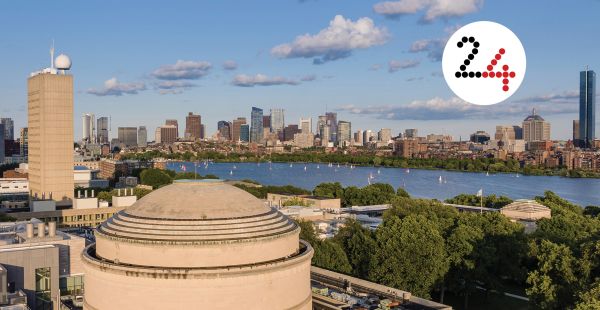 Aerial view of MIT dome with Charles River and Boston visible in the distance. Layered on top is a white circle with the number 24.