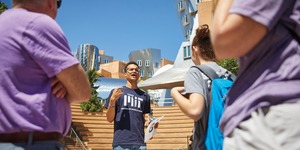 An MIT student speaks to a group on campus